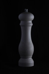 Fototapeta premium white pepper shaker on a dark background