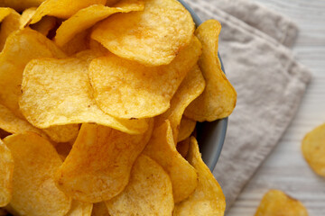 Bacon Flavored Potato Chips in a Bowl, top view. Flat lay, overhead, from above.