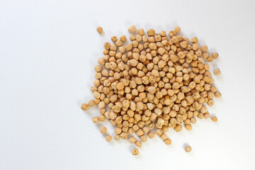 Chickpeas scattered in a circle on white background, versatile, nutritious, and ideal for healthy cooking and snacking