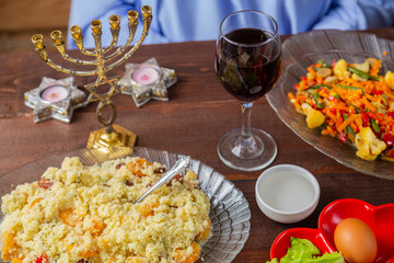 The table is festively set with matzo and kearah for the Pesach Seder holiday