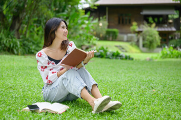 Beautiful young woman appears relaxed and focused, enjoying a quiet moment outdoors.