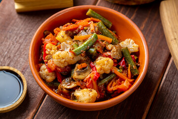 chicken in spices and vegetables stewed on the table