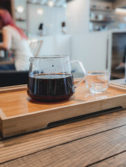 Specialty Coffee Pour Over in Glass Carafe with Cup and Tray in Cafe, Hong Kong