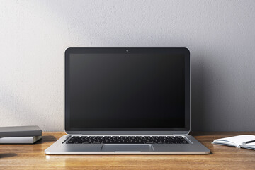 Fototapeta premium Modern laptop with blank screen on wooden desk in clean, minimalistic setup. 3D Rendering