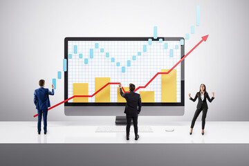 Business people analyzing financial charts and celebrating growth.