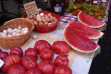 Southern market in Italy. Colorful fruit market in the morning in the southern Italian city of Crotone 07/28/2024. Onions from Tropea, tomatoes and red hot peppers from Calabria.