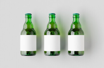 Green steinie beer bottle mockup with blank label.