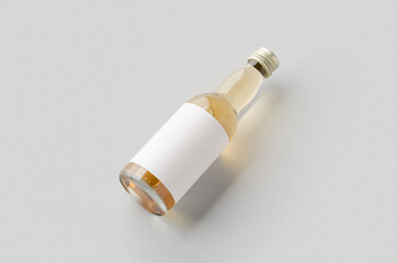 Miniature spirits, liquor bottle mockup. Clear glass, amber liquid with a blank label.