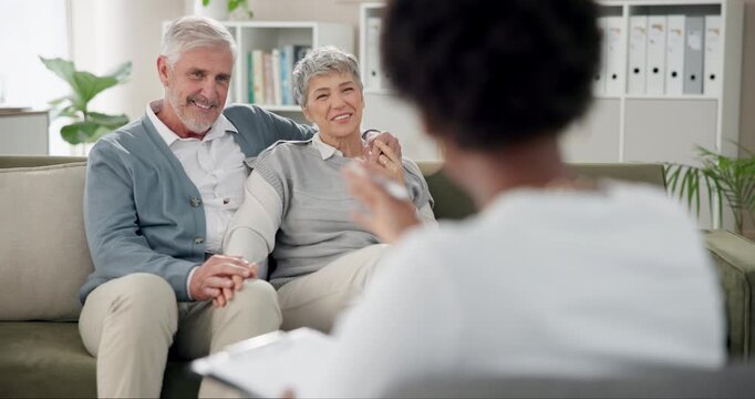 Senior couple, therapist and consultation in office, hug and happiness with advice, marriage counsellor and love. Clinic, old man and mature woman on couch, psychologist and support with conversation