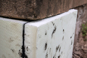 Close-up of insulation of foundations with foam boards, improvement of energy efficiency