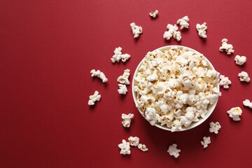 Delicious popcorn on a colored background