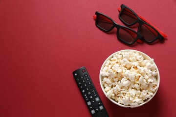 Delicious popcorn on a colored background