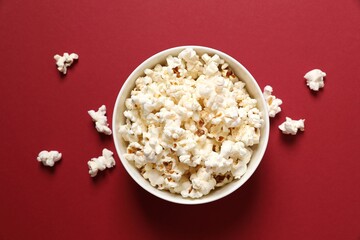 Delicious popcorn on a colored background