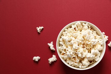 Delicious popcorn on a colored background