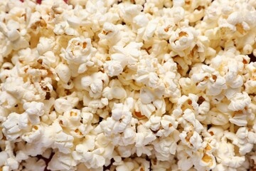Delicious popcorn on a colored background