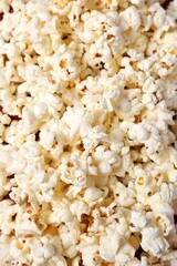 Delicious popcorn on a colored background