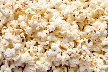 Delicious popcorn on a colored background