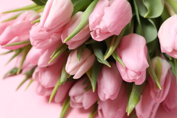 Fototapeta premium Beautiful fresh tulips on color background