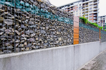 stones in a metal mesh for strengthening the wall.
