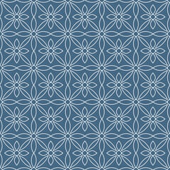 Seamless pattern of floral ornament shapes, with white curved lines on a denim blue background. Suitable for various decorative purposes with a natural theme.