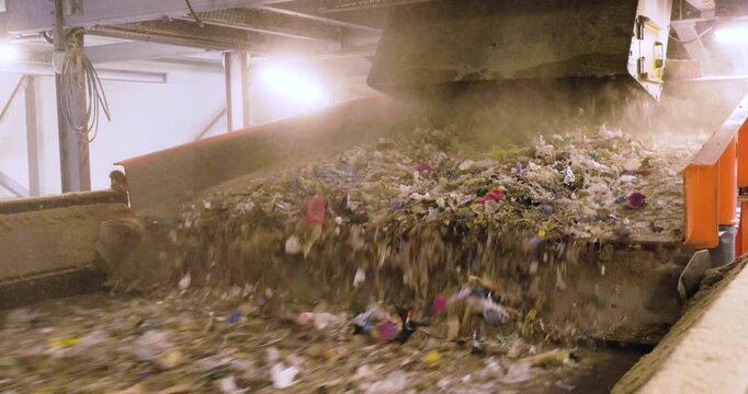  Footage of Refuse-Derived Fuel (RDF) on Conveyor Belt in Recycling Facility - Sustainable Waste Management and renewable energy production.