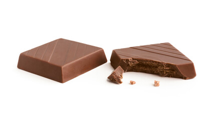 Milk chocolate pieces on a white background