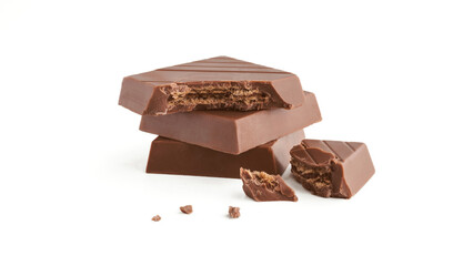 Milk chocolate pieces on a white background