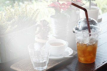 Cold black coffee drinks placed on a wooden table