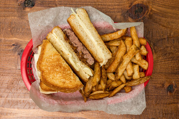 Hamburger with grilled cheese and French fries