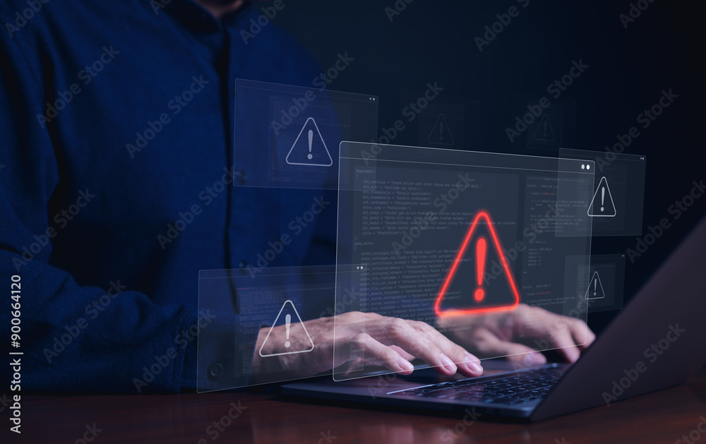 Wall mural cybersecurity alert concept. person using laptop with multiple warning symbols displayed, indicating
