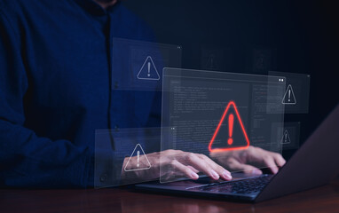Cybersecurity alert concept. Person using laptop with multiple warning symbols displayed,...