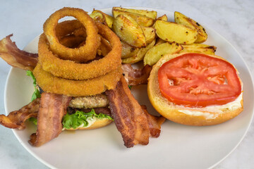 hamburger  with onion rings and bacon,