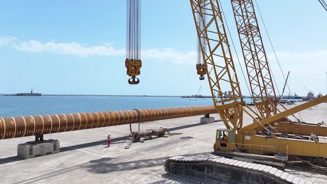 Operating large cranes and pipes on a deepwater rig