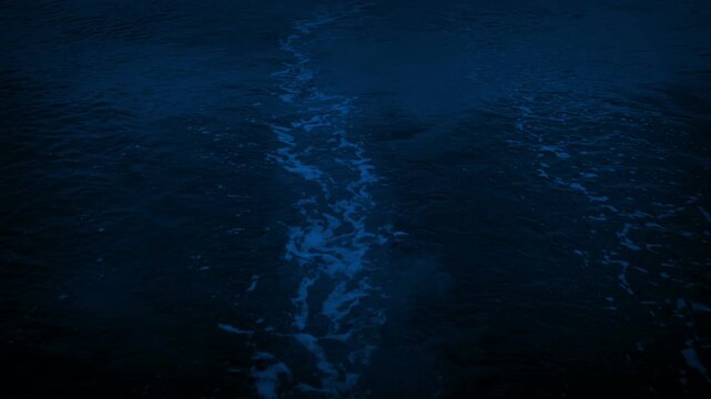 Wake Behind Motor Boat At Night