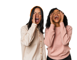 Young Latin friends together in studio shouting excited to front.