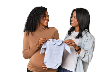 Two Latin women, one pregnant, with baby's bodysuit in studio