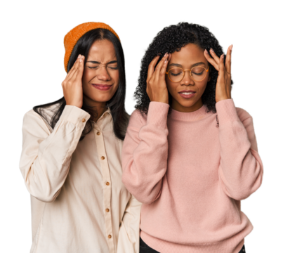 Young Latin friends together in studio touching temples and having headache.