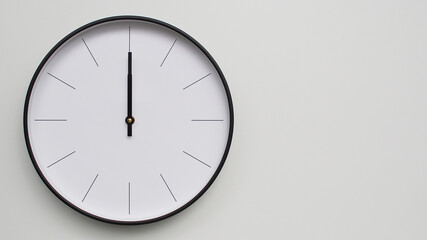 Wall Clock Showing 12.00 or 0.00 O'Clock on White Wooden Surface - Perfect for Time Management and Scheduling Concepts