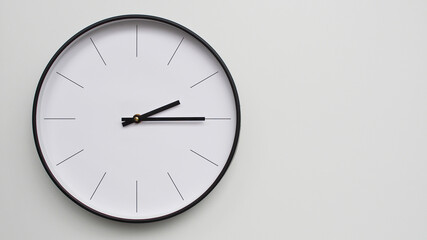 Wall Clock Showing 14.15/02.15 O'Clock on White Wooden Surface - Perfect for Time Management and Scheduling Concepts