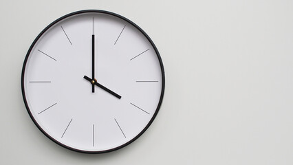 Wall Clock Showing 16.00/04.00 O'Clock on White Wooden Surface - Perfect for Time Management and Scheduling Concepts