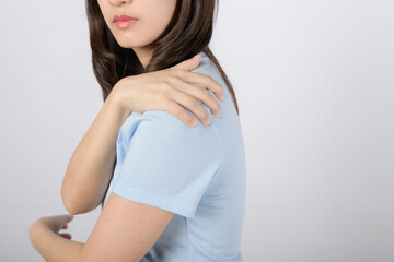Shoulder muscle pain injury. Woman hold her pained arm shoulder muscle isolated on white...