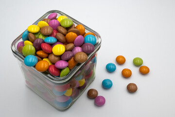 Colorful candies in sweet chocolate.
