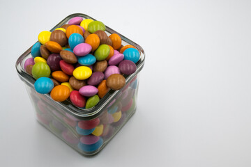 Colorful candies in sweet chocolate.
