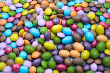 Colorful candies in sweet chocolate.
