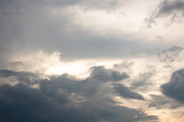 Obraz premium The sky is cloudy and grey. The clouds are low and dark. The sun is shining through the clouds