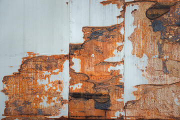 The image is a close up of a rusty metal surface with a lot of texture. The rust gives the surface a worn and aged appearance, which can evoke feelings of nostalgia or a sense of history