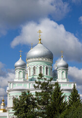 Diveevo, Nizhny Novgorod region, Russia - July, 21, 2024: Trinity Cathedral with silver domes of Diveevo monastery on a sunny summer day