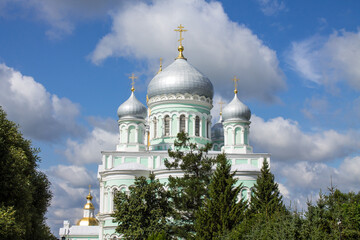 Diveevo, Nizhny Novgorod region, Russia - July, 21, 2024: Trinity Cathedral with silver domes of Diveevo monastery on a sunny summer day