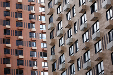 New residential buildings with boxes for air conditioners. House development, high-rise construction