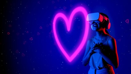 Fototapeta premium Beautiful Asian woman in VR to metaverse interacting virtual neon flowers drawing lighting pink heart with fingers blossom blue background 3D pollen graphic floating meta garden world. Hallucination.